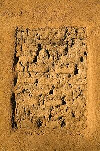 Closeup of a wall on the oldest adobe house in Santa Fe, New Mexico, USA