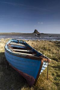 Row boat on the shore of Beblowe Craig, England