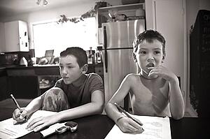 Boys drawing at kitchen table