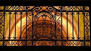 Gate silhouette over architecture
