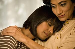 Mother and daughter hugging