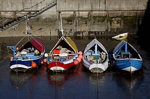 Boats moored to dock, Amble, Northumberland, England