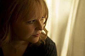 Woman looking out the window