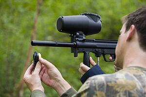 Man loading paintball gun