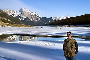 Man standing in front of Medicine Lake, Alberta, Canada