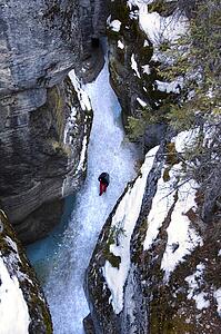 Person walking in Maligne Canyon in the winter, Alberta, Canada