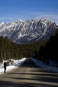 Person beside the highway in the Maligne Mountain Range, Alberta, Canada