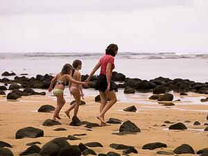 Walking along a beach in Kauai, Hawaii, USA