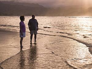 Couple on the beach in Kauai, Hawaii, USA