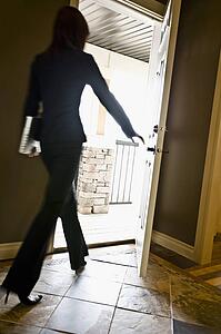 Woman walking out a door