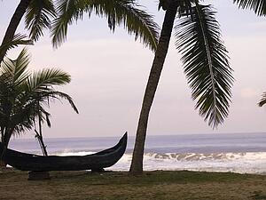 Canoe on the beach, Arabian Sea, Kerala, India 