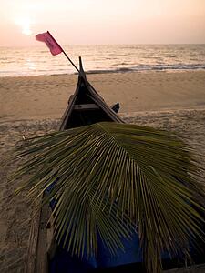 A canoe on the beach at the Arabian Sea, Kerala, India 