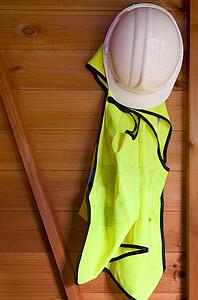 Reflective vest and hardhat hanging up