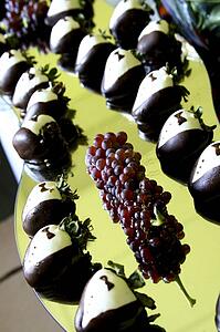 Strawberries decorated to look like tuxedos