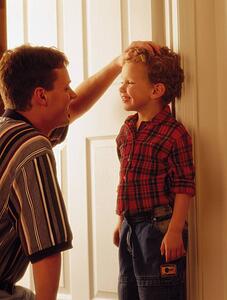 Father and son looking in eyes and smiling