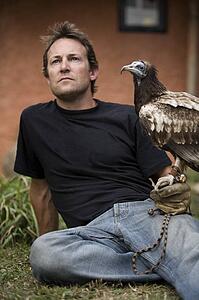 Man with Egyptian vulture (Neophron percnopterus), Pokhara, Nepal