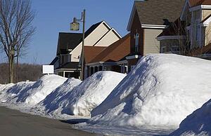 Snow piled on edge of street