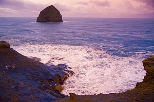 Haystack Rock at sunset at Cape Kiwanda, Oregon, USA