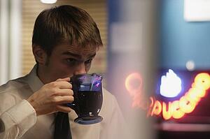 Man drinking a cup of coffee