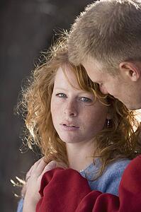 Man comforting a woman