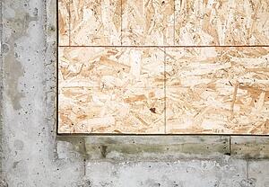 Corner piece of wood encased in concrete