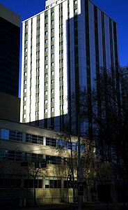 Sun shining on tall building