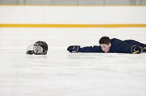 Hockey player who has fallen on the ice