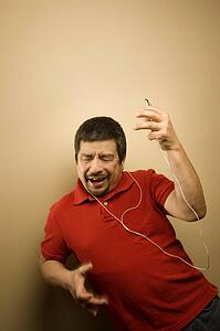 Man listening to music player