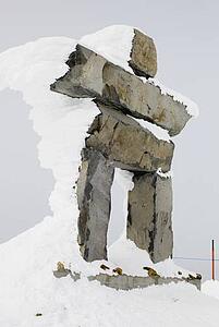 Snow-covered inuksuk