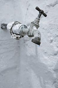 Old tap leaking water 