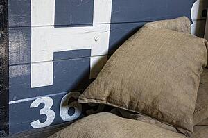 Sacks piled in front of wooden crate