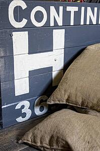 Sacks piled in front of wooden crate