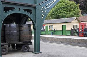Barrels On A Cart In A Train Station