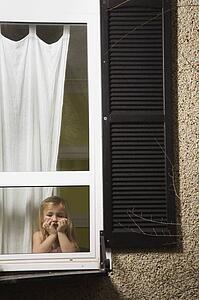 A girl looking out a window