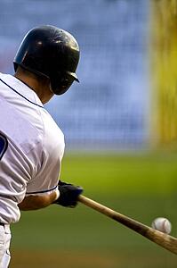 Rear view of a baseball player at bat