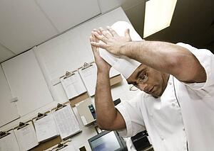 Chef putting hat on