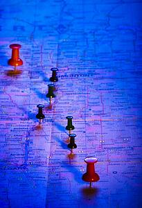 Thumbtacks on a map