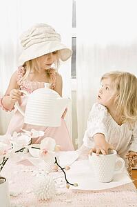 Two girls having a tea party