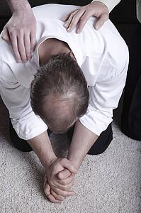 Man praying on his knees