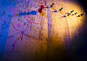 Thumb tacks on a map