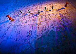 Thumb tacks on a map