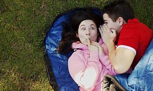 Couple telling a secret