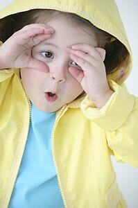 A little girl in a raincoat