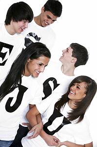 Five teenagers with t-shirts spelling Jesus