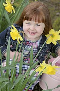 Little girl with daffodils