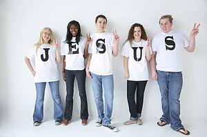 Five teenagers with t-shirts spelling Jesus