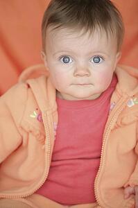 Baby in orange jacket