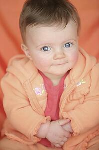 Baby in orange jacket