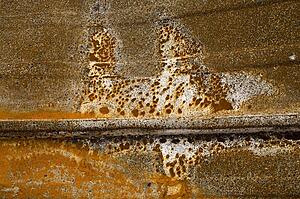 Detail of burned and rusty metal