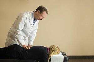 Chiropractor with his patient